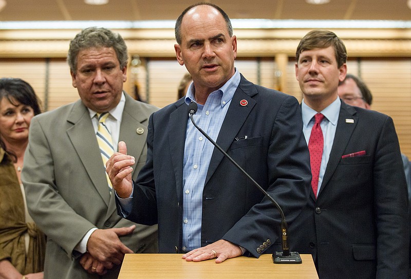 
              Former U.S. Rep. Zach Wamp, center, announces at a news conference in Nashville, Tenn., on Monday, Nov. 30, 2015, that Republican presidential candidate Marco Rubio has assembled a full slate of delegates in Tennessee. They include state House Majority Leader Gerald McCormick, left, and Sen. Brian Kelsey, right. Wamp is Rubio’s state chairman. (AP Photo/Erik Schelzig
            