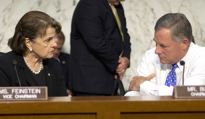 
              FILE - In this Sept. 24, 2015 file photo, Senate Intelligence Committee Chairman Sen. Richard Burr, R-N.C., right, confers with committee Vice Chair. Sen. Dianne Feinstein, D-Calif. on Capitol Hill in Washington. A proposed law meant to encourage companies to share information about cyber threats with the U.S. government includes measures that could significantly limit what details, if any, the public can review about the program through federal and state public records laws. (AP Photo/Pablo Martinez Monsivais, File)
            