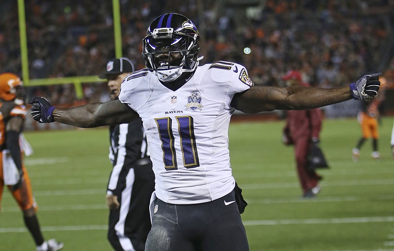Baltimore Ravens wide receiver Kamar Aiken celebrates after scoring a 15-yard touchdown in the second half of an NFL football game against the Cleveland Browns on Monday, Nov. 30, 2015, in Cleveland.
