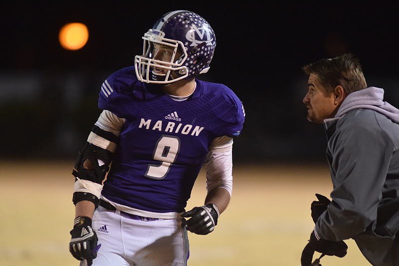 Bradley Baxter (9) is instructed by head coach Ricky Ross.  The Knoxville Grace Christian Rams visited the Marion County Warriors in the semifinal  round of the TSSAA football playoffs Friday night in Jasper.  