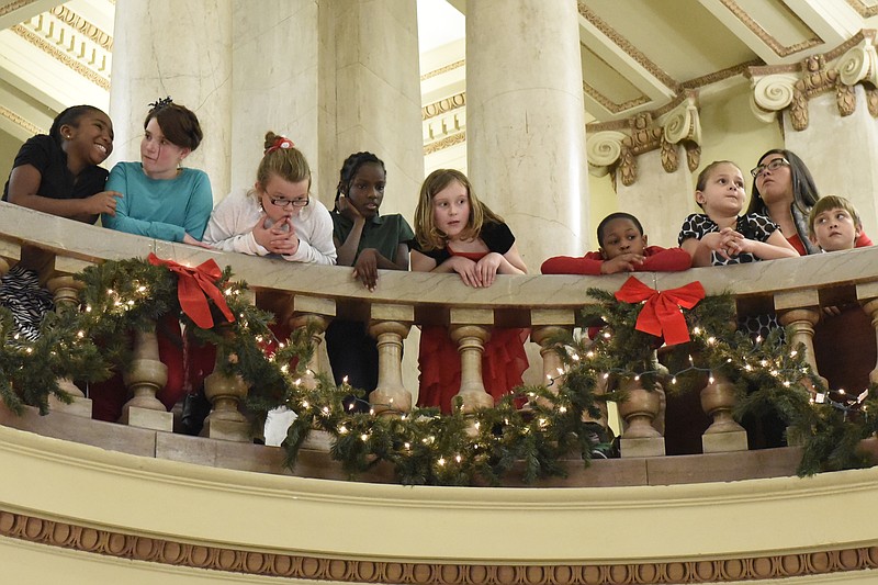Members of the Rivermont Elementary chorus watch from an upper floor as the Loftis Middle School chorus performs during the first Christmas at the Courthouse concert on Tuesday, Dec. 1, 2015, at the Hamilton County Courthouse rotunda in Chattanooga.