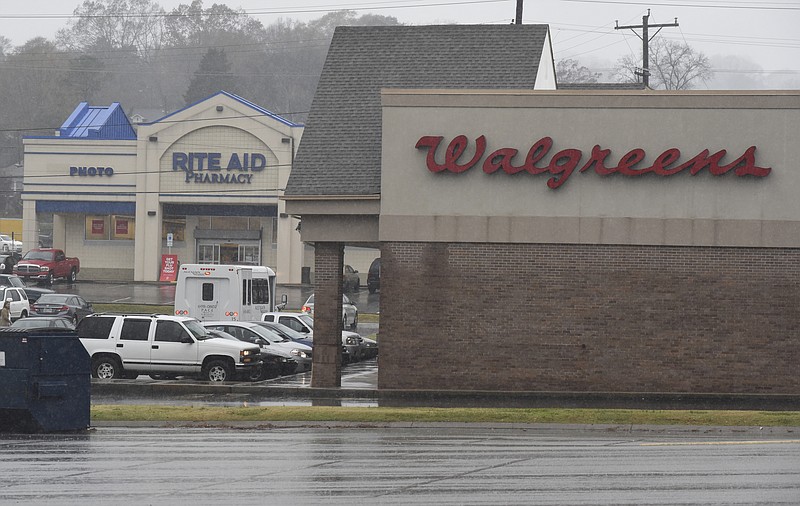 Seen Monday, Nov. 30, 2015, in Chattanooga, Tenn., Walgreens and Rite Aid pharmacies are next door neighbors on Brainerd Road, located across Germantown Road from each other. 