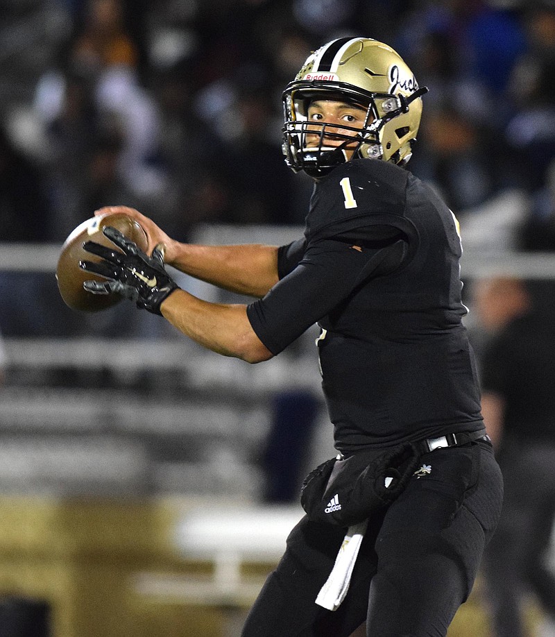 Calhoun quarterback Kaelan Riley (1) warms up before the game.  The Elbert County Blue Devils visited the Calhoun Yellow Jackets in a GHSA Football Playoff game on Friday November 27, 2015.