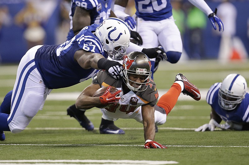 
              FILE - In this Nov. 29, 2015 file photo, Tampa Bay Buccaneers running back Charles Sims (34) dives under Indianapolis Colts defensive tackle T.Y. McGill (67) during the first half of an NFL football game in Indianapolis. The Colts defense has held up against Denver, Atlanta and Tampa Bay over the past four weeks. On Sunday, Dec. 6 they'll face their biggest test yet, against a Pittsburgh team that dismantled the Colts just last season (AP Photo/AJ Mast)
            