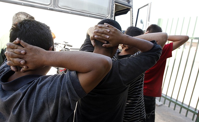 Illegal immigrtants caught in Arizona by the U.S. Border Patrol are processed at the agency's Tucson Sector headquarters in Tucson, Ariz.