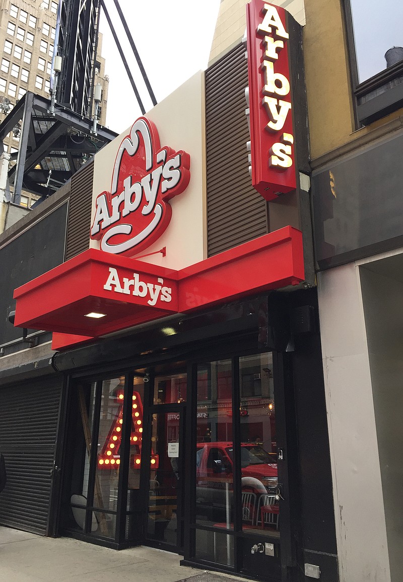 
              This Thursday, Dec. 3, 2015 photo shows the outside of the new Arby's restaurant in New York.  Arby’s is opening in Manhattan later this month as growing sales make an outpost in the pricey real estate market worthwhile. The Atlanta-based chain known for its roast beef sandwiches is enjoying a bit of a revival thanks in part to some pop culture moments.  (AP Photo/Candice Choi)
            