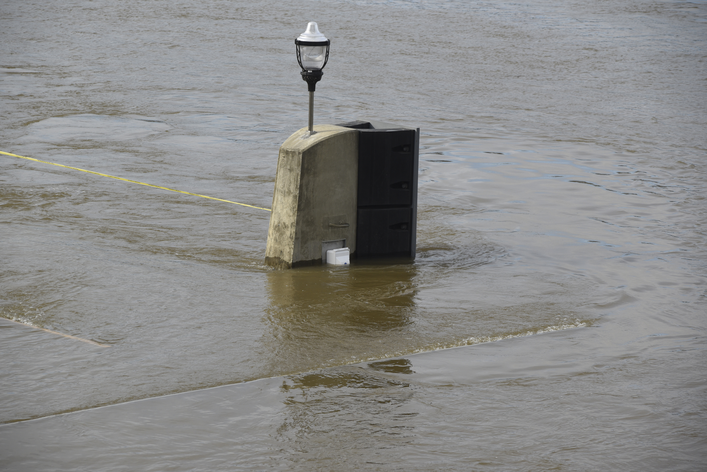 Seen Wednesday, Dec. 2, 2015, in Chattanooga, Tenn., the rising level of the Tennessee River has covered the dock and lower steps at the 21st Century Waterfront at Ross's Landing.