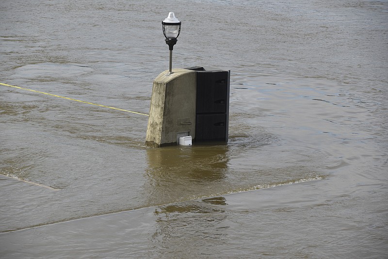 Seen Wednesday, Dec. 2, 2015, in Chattanooga, Tenn., the rising level of the Tennessee River has covered the dock and lower steps at the 21st Century Waterfront at Ross's Landing. 