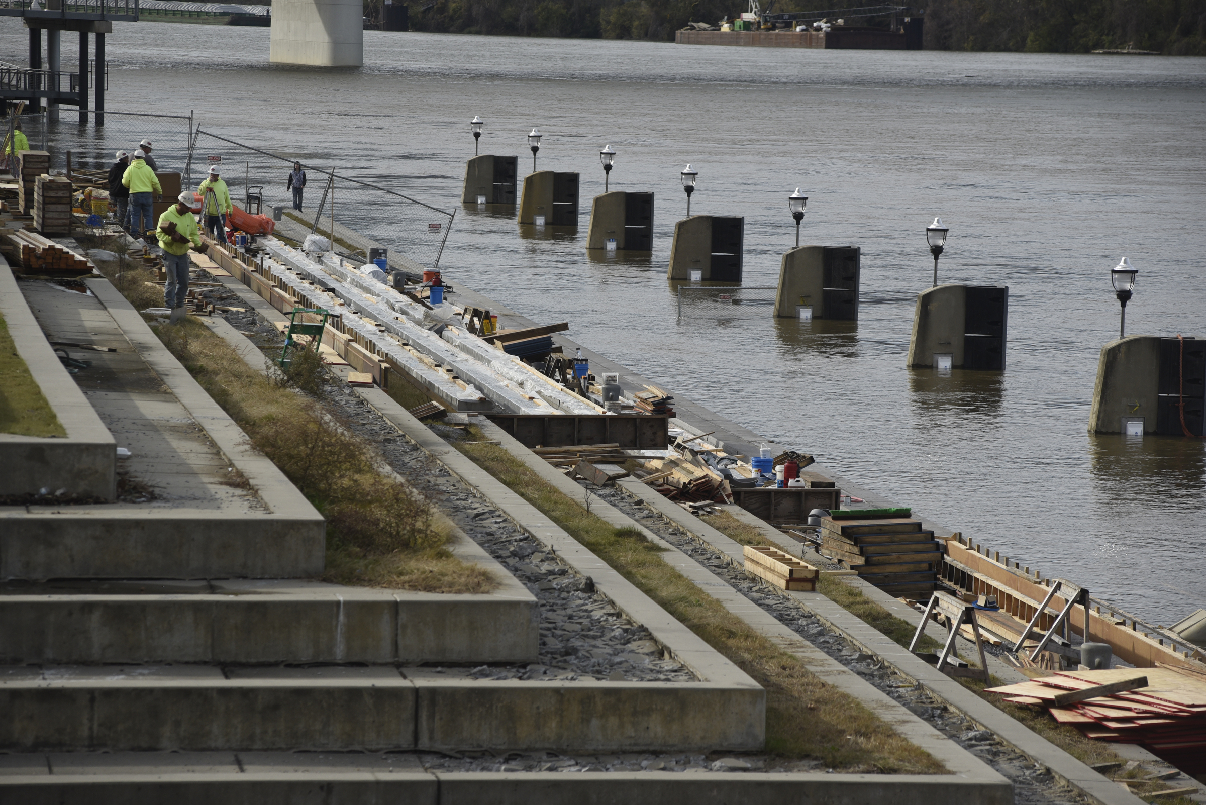Seen Wednesday, Dec. 2, 2015, in Chattanooga, Tenn., the rising level of the Tennessee River has covered the dock and lower steps at the 21st Century Waterfront at Ross's Landing.