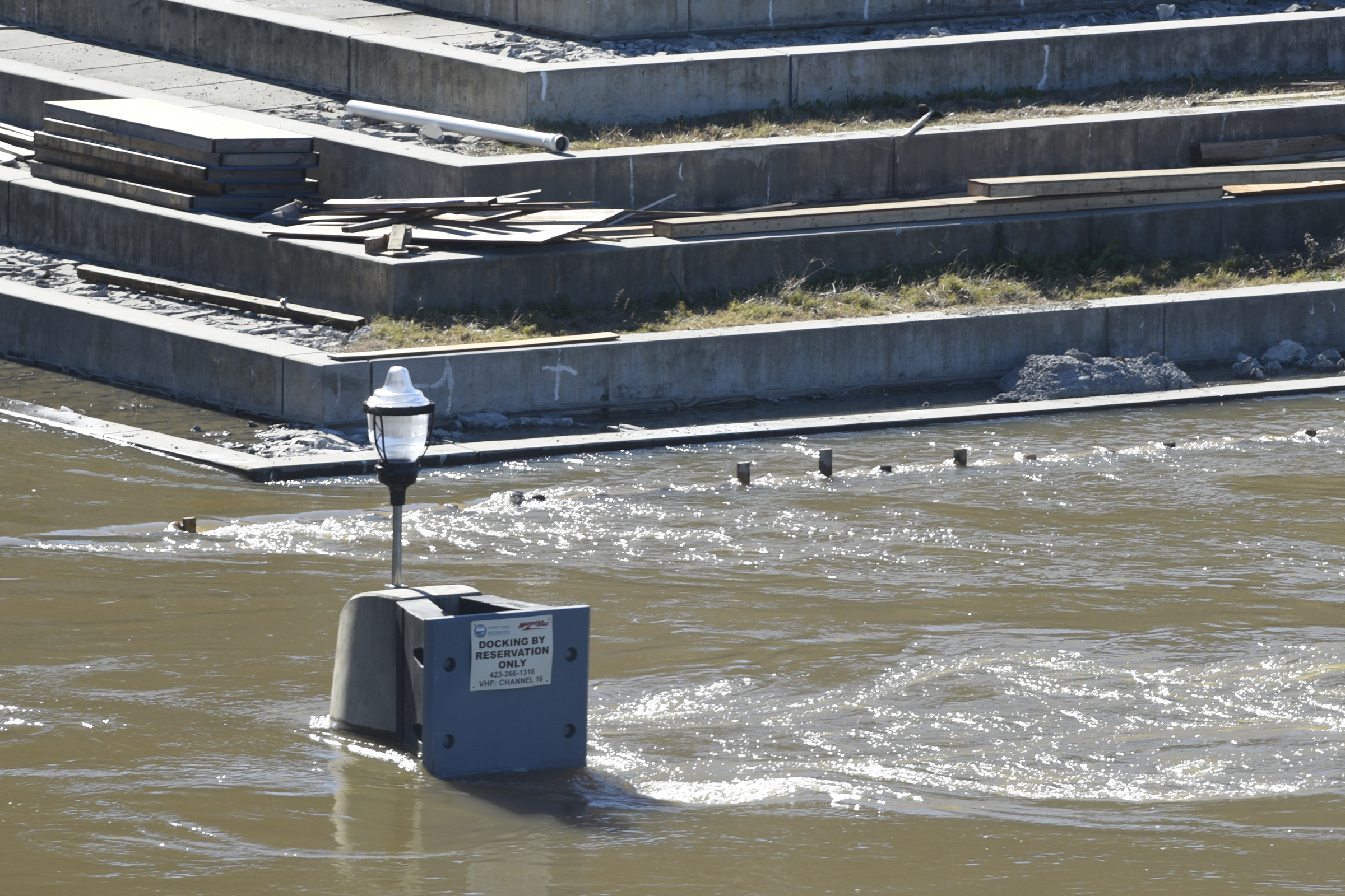 Seen Thursday, Dec. 3, 2015, in Chattanooga, Tenn., the rising level of the Tennessee River has covered the dock and lower steps at the 21st Century Waterfront at Ross's Landing.