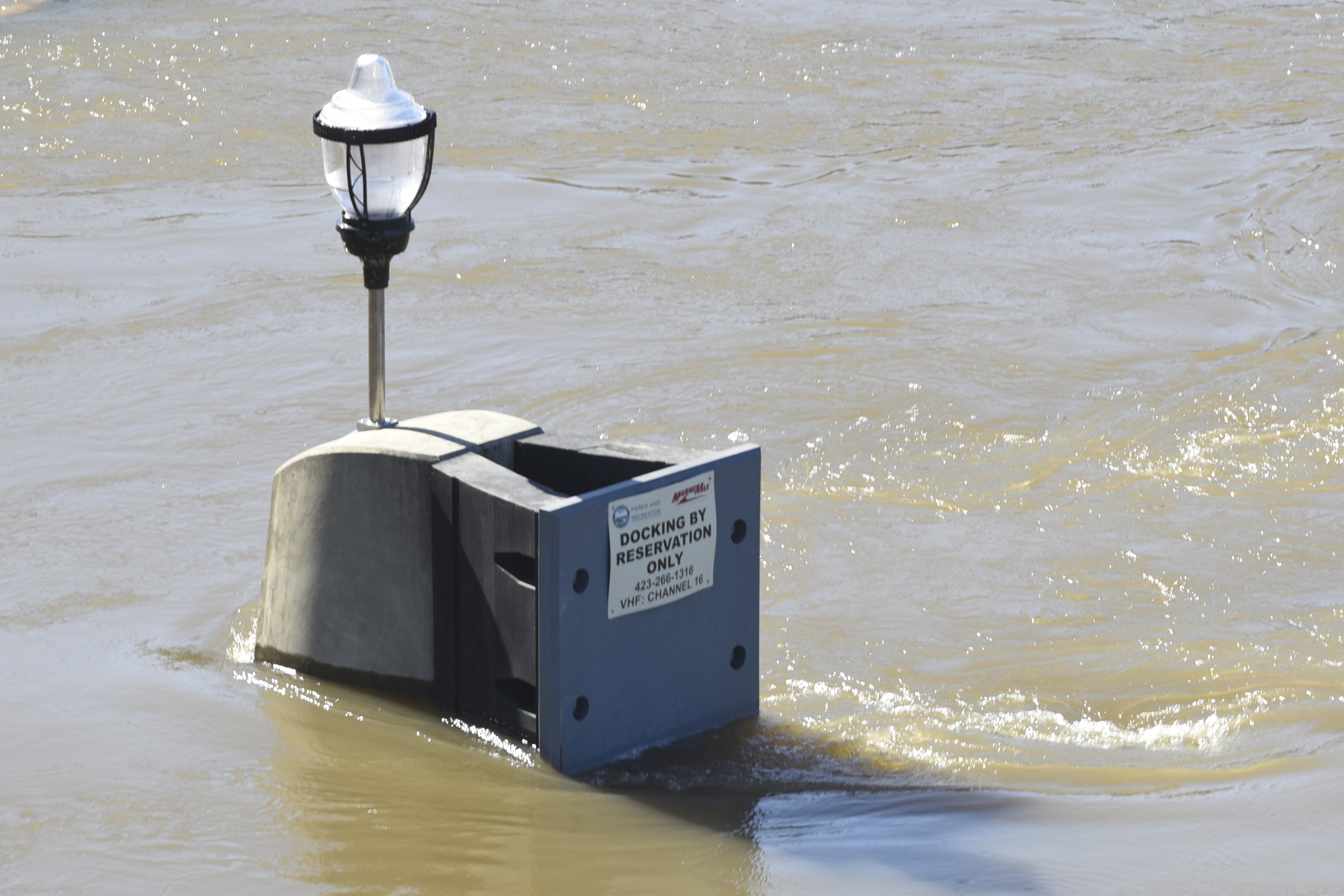 Seen Thursday, Dec. 3, 2015, in Chattanooga, Tenn., the rising level of the Tennessee River has covered the dock and lower steps at the 21st Century Waterfront at Ross's Landing.