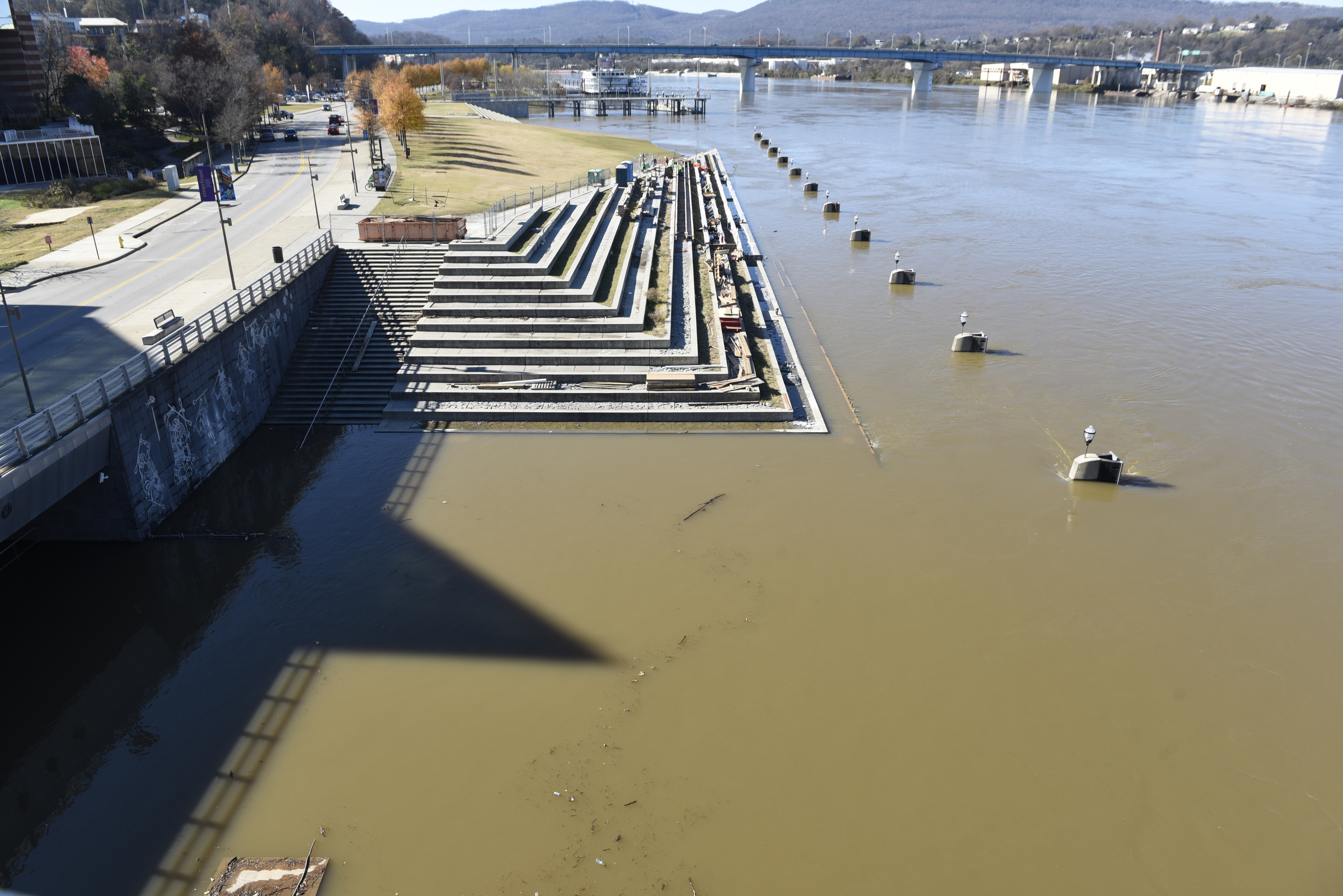 Seen Thursday, Dec. 3, 2015, in Chattanooga, Tenn., the rising level of the Tennessee River has covered the dock and lower steps at the 21st Century Waterfront at Ross's Landing.