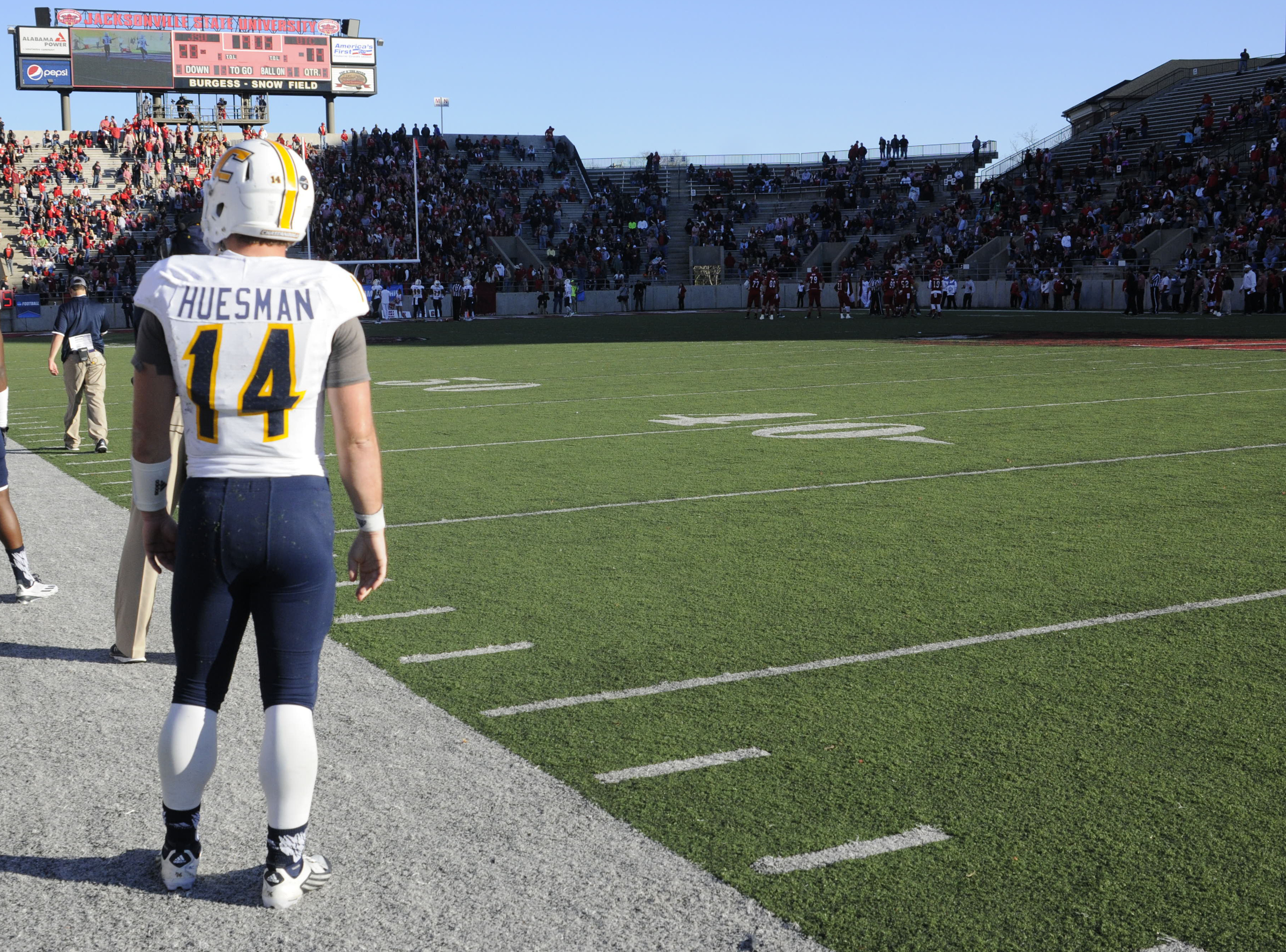 Mocs quarterback Jacob Huesman stands alone on the side line as Jacksonville State has the ball late in the second half inSaturday's 41-35 loss.