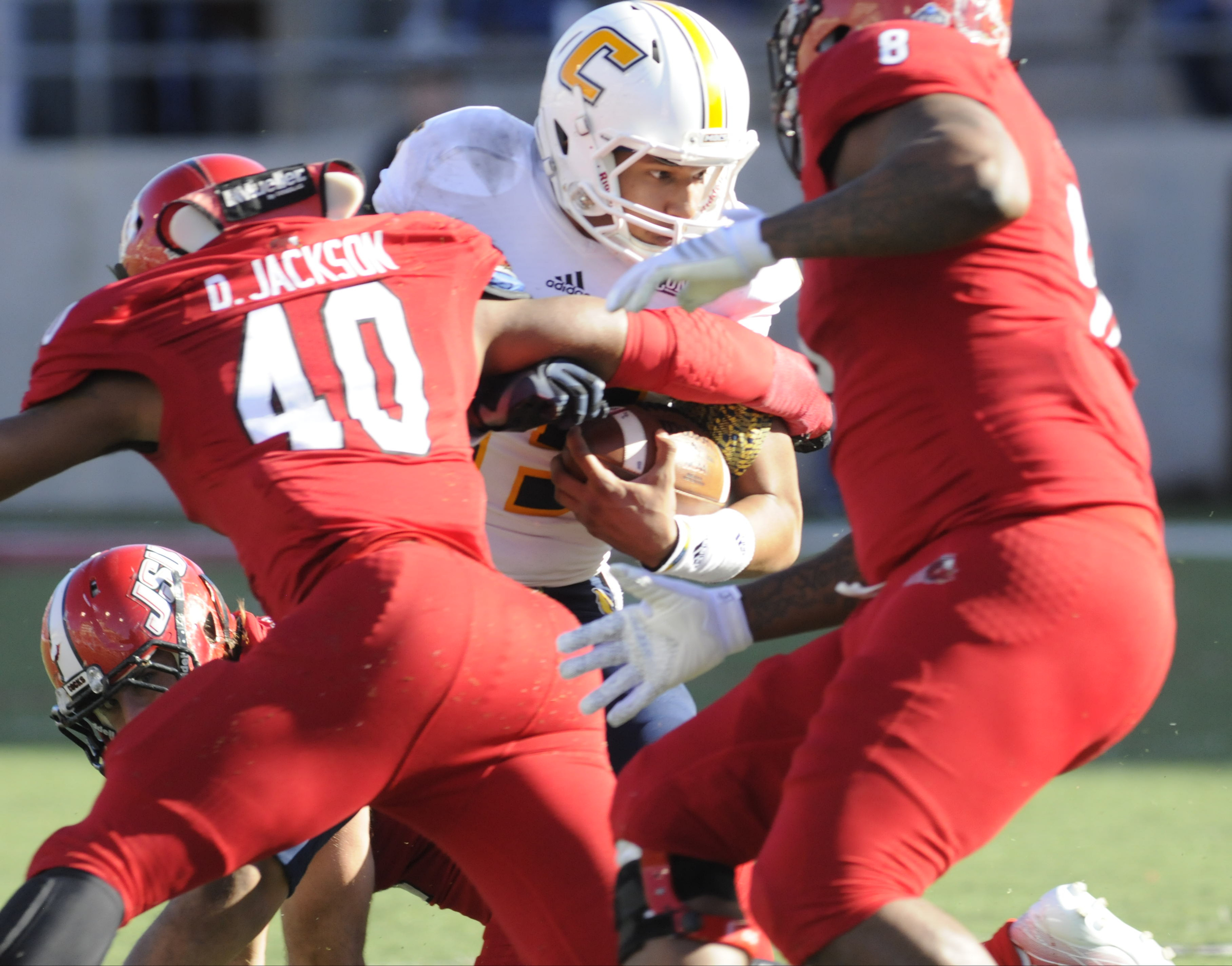 UTC's Alejandro Benefield (15) runs ahead for yardage early in first half action at Jacksonville State.