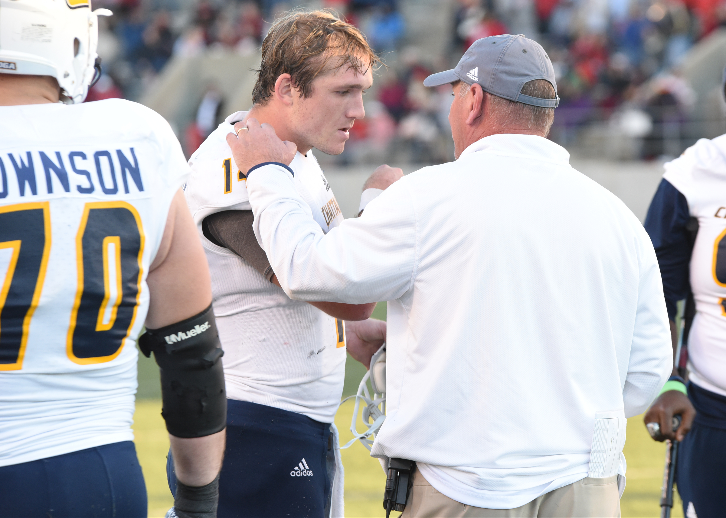 UTC coach Russ Huesman instructs his son, Jacob, late in the fourth quarter as the game is tied at 35-35.