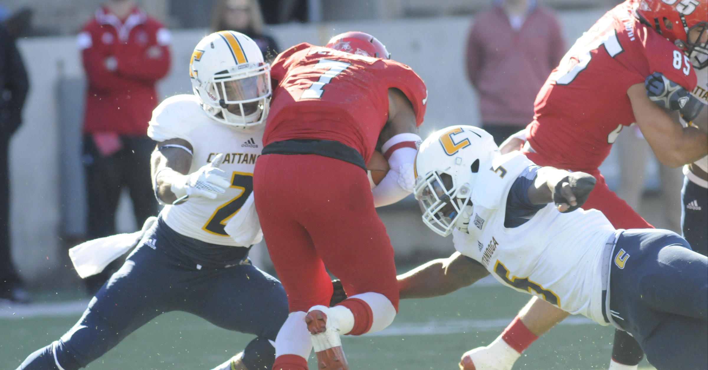 UTC defenders Cedric Nettles (2) and Nakevian Leslie (5) make a crucial stop on Jacksonville State quarterback Eli Jenkins (7) in the second half.