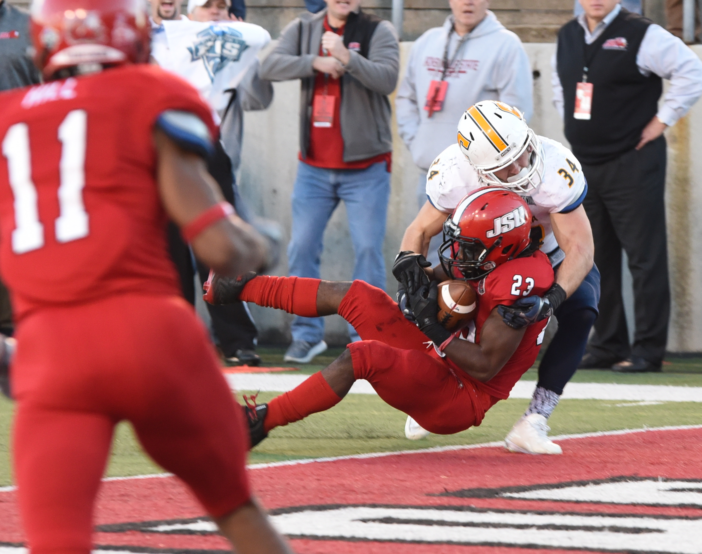 Jacksonville State's Brandon Bender (23) intercepts a pass intended for UTC's Derrick Craine (34) in overtime, setting up the Gamecocks for what turned out to be the winning touchdown. The final score was 41-35.