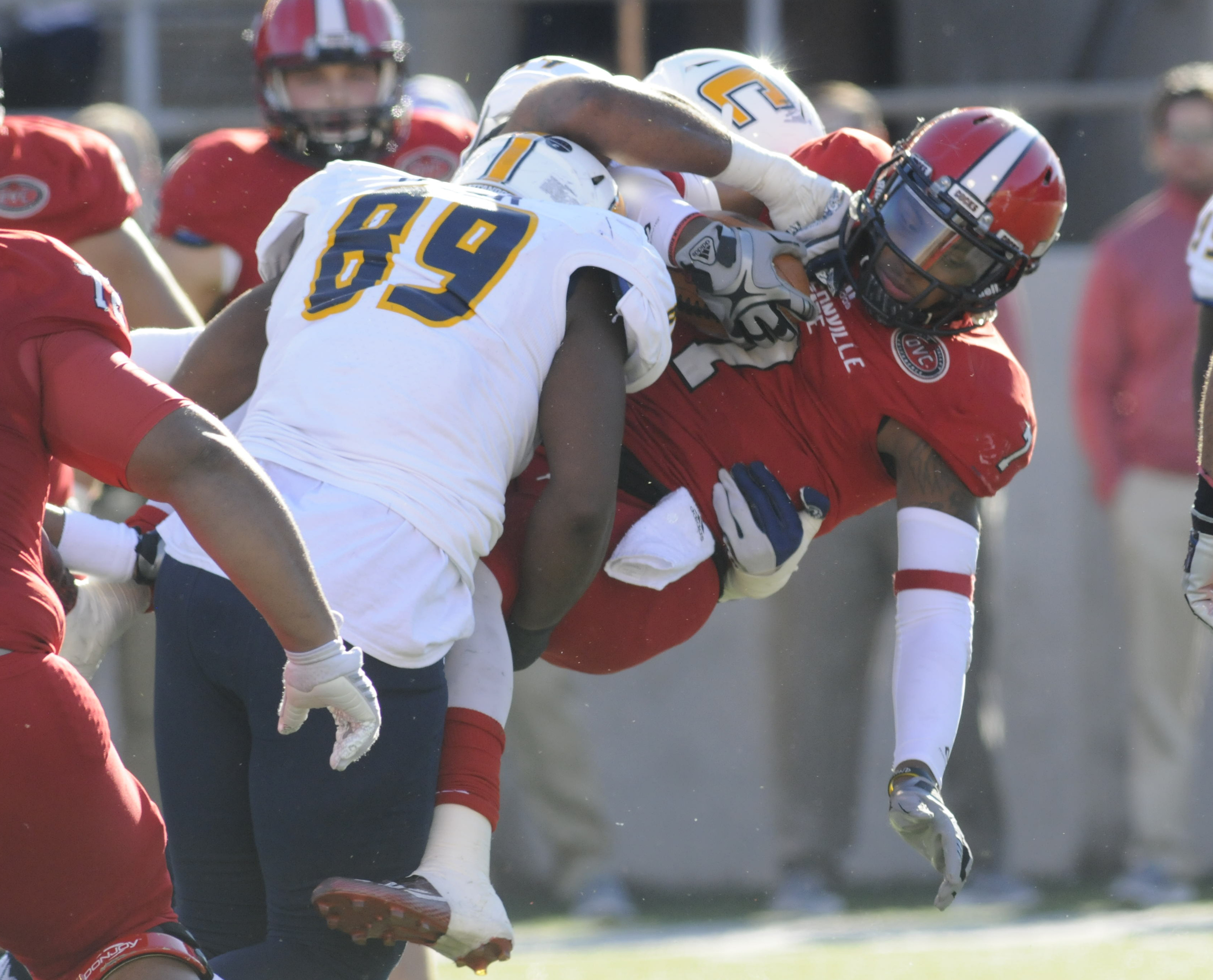 Jacksonville State quarterback is hit by the Mocs defensive line in first half action in Saturday's 41-35 loss.