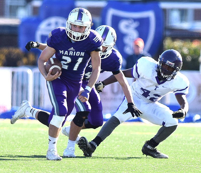 Marion County's Josh Henderson (21) looks for running room around left end.  The Marion County Warriors faced the Trezevant Bears in the Division I Class 2A Tennessee State Football Championships in the BlueCross Bowl at Tennessee Tech's Tucker Stadium on Saturday, December 5, 2015.