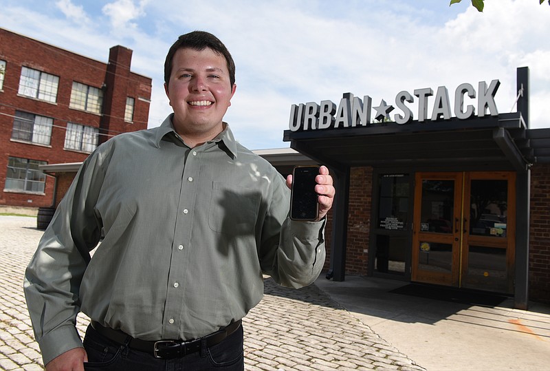 Andrew Byrum, a recent graduate of the College of Business at UTC, is photographed at the Urban Stack, a Chattanooga restaurant that is beta testing the new app made and operated by his company, Get Seated. The app will allow customers to evaluate and manage wait times at restaurants.