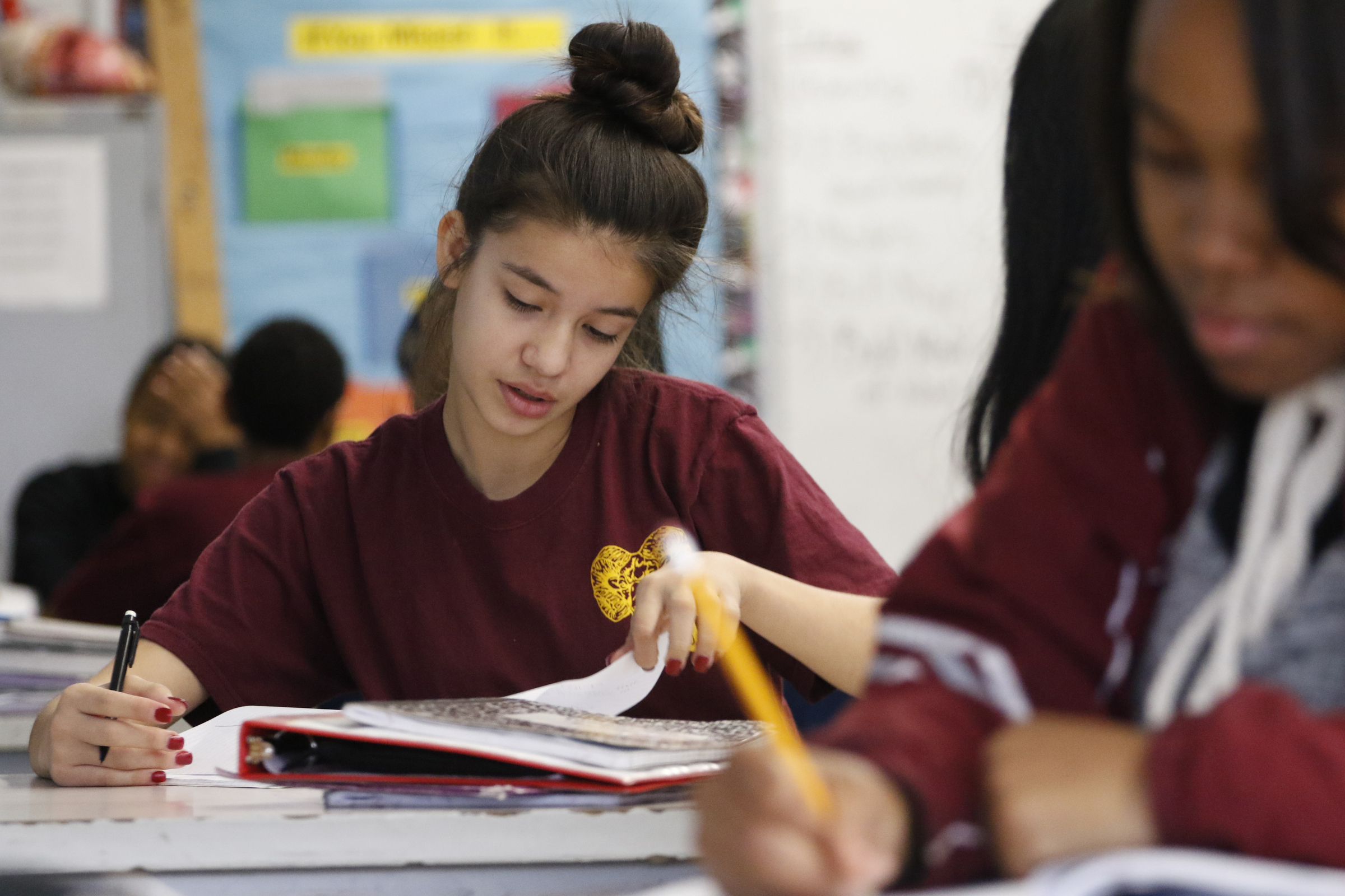 Staff Photo by Dan Henry / The Chattanooga Times Free Press- 12/9/15. Jacky Venzor takes notes about waves and frequency during Anthony Goad's 7th grade science class at Tyner Academy Middle School on Wednesday, December 9, 2015.