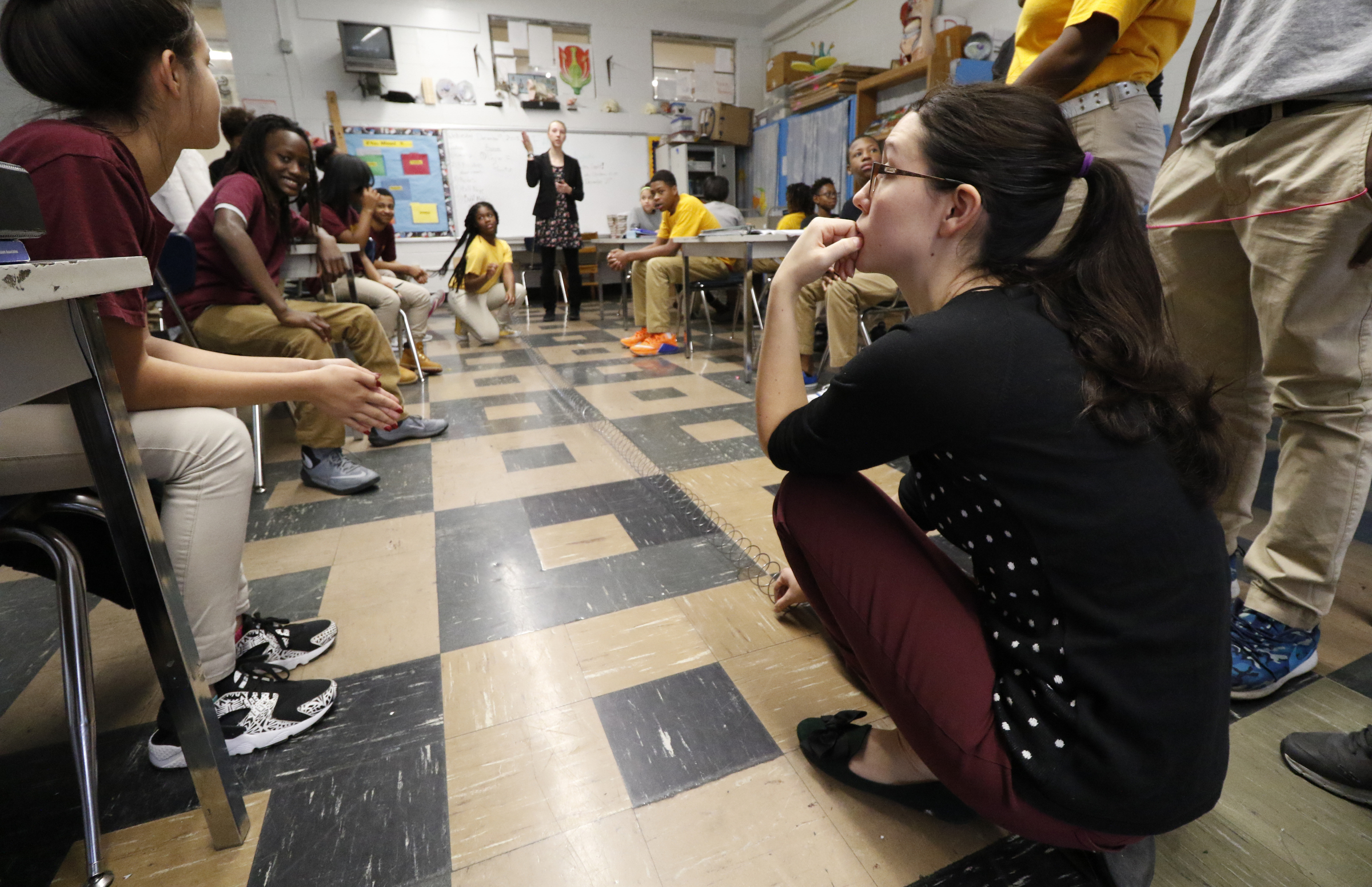 Staff Photo by Dan Henry / The Chattanooga Times Free Press- 12/9/15. Resident teacher Tiffany Cockran uses a slinky to visualize how a frequency works during Anthony Goad's 7th grade science class at Tyner Academy Middle School on Wednesday, December 9, 2015.
