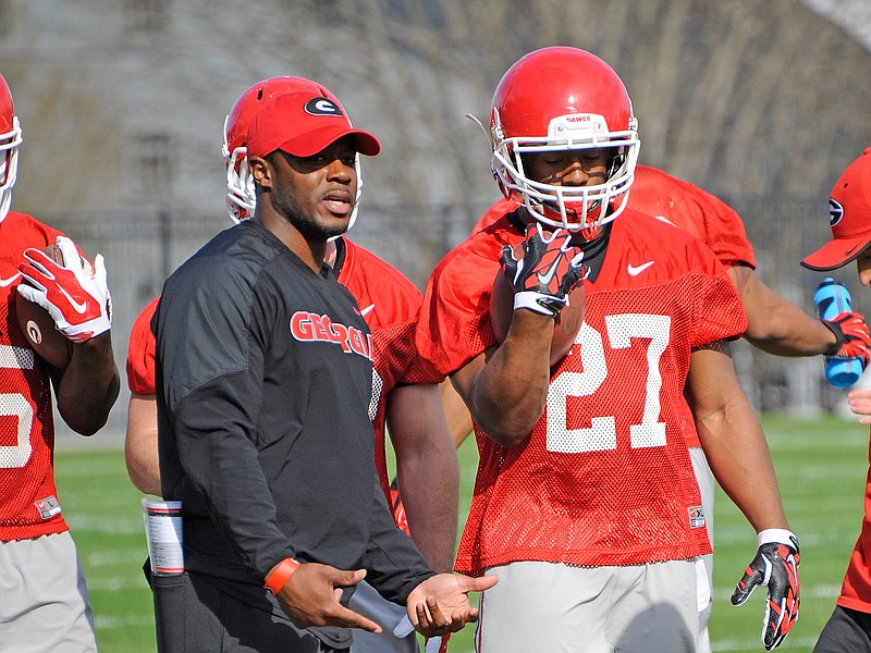 Georgia running backs coach Thomas Brown, shown here in spring practice with Nick Chubb, has been recruiting with new coach Kirby Smart.