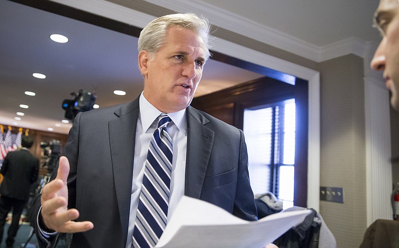 Majority Leader Kevin McCarthy, R-Calif., speaks with a reporter following a closed-door GOP caucus meeting at the Republican National Headquarters on Capitol Hill in Washington on Tuesday, Dec. 8, 2015.