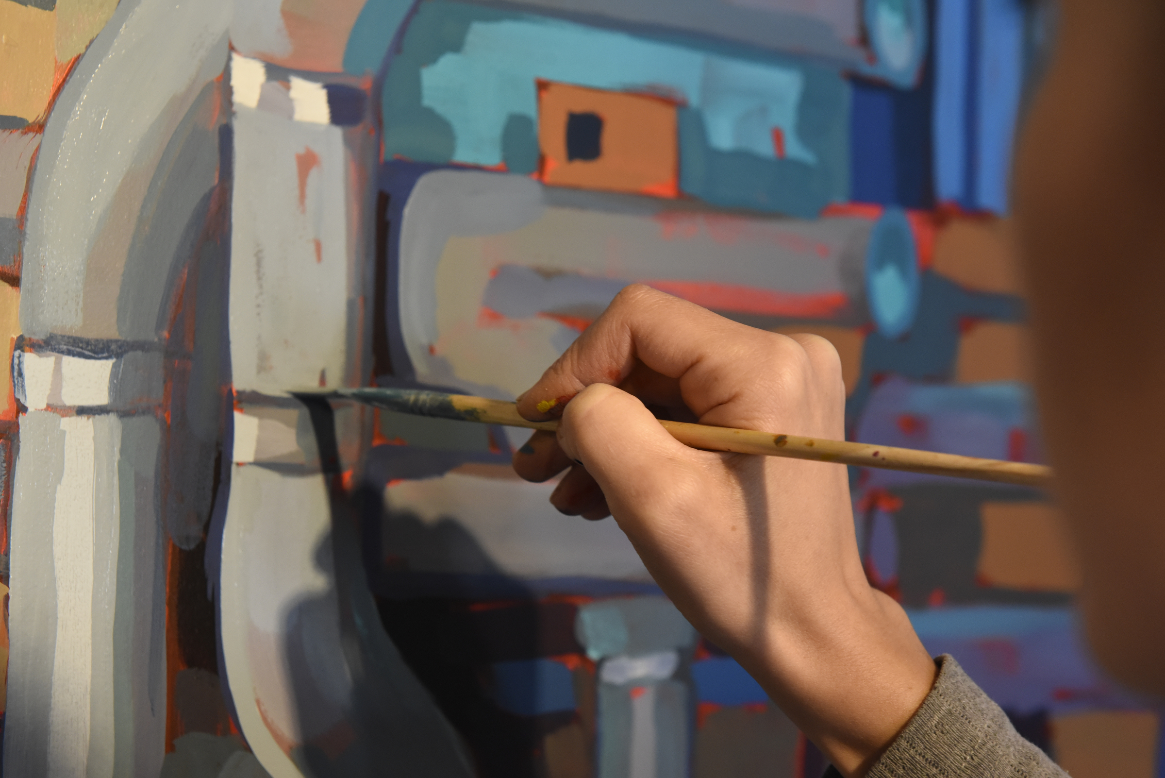 Ali Kay works on a mural in the lobby of the Chattanooga WorkSpace building on Thursday, Nov. 19, 2015, in Chattanooga, Tenn. This mural, eight feet tall and 21 feet wide, is one of eight of her murals that will be displayed in offices of MetalTek around the country.