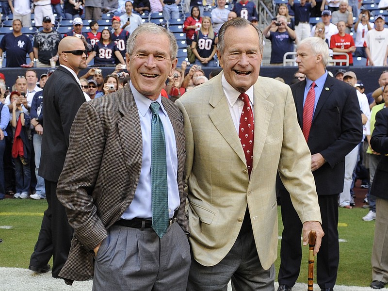 Former President George H.W. Bush, right, shown with son George W. Bush in 2009, was an underestimated president, according to biographer Jon Meacham.