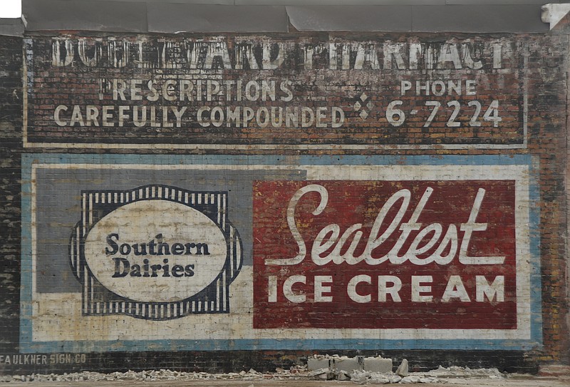 Old advertisements cover a wall next to 325 Cherokee Blvd., Thursday, December 10, 2015, at the Lee Highway memorial