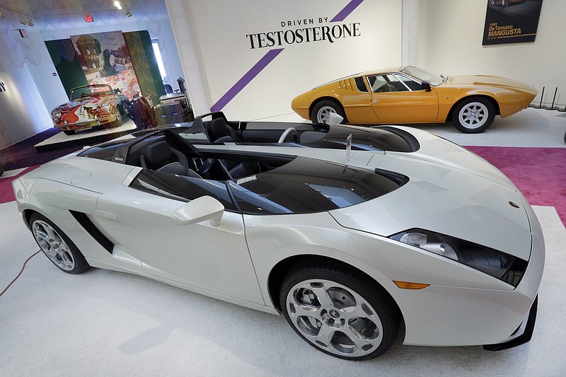 
              CORRECTS YEAR OF PORSCHE 356C CABRIOLET TO 1964 FROM 1965 - A 2006 Lamborghini Concept S, foreground, estimated $2.4 million - $3 million, and a 1969 De Tomaso Mangusta, upper right, estimated at $300,000 - $350,000, are displayed during a preview of the "Driven by Disruption" sale at Sotheby's, in New York, Friday, Dec. 4, 2015. Singer Janis Joplin's wildly painted 1964 Porsche 356C Cabriolet, estimated at more than $400,000, is at upper left. (AP Photo/Richard Drew)
            