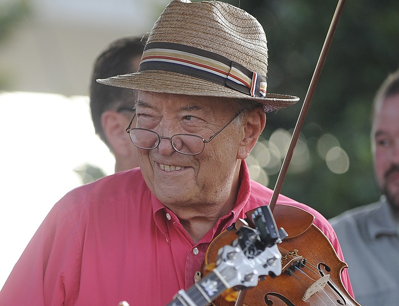 Fletcher Bright, with the Dismembered Tennesseans, plays fiddle during Pops on the River at Coolidge Park.