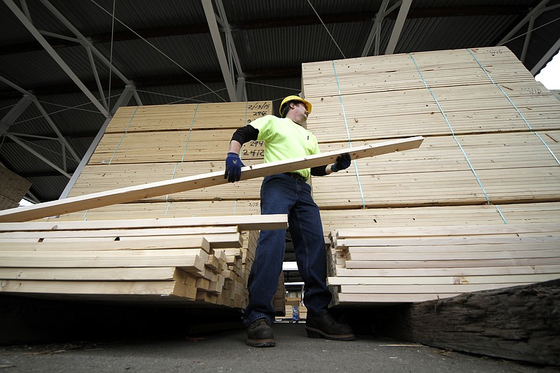 
              FILE - In this March 31, 2015 file photo, Chuck Barrett helps a customer load 2x4's at the Allegheny Millwork and Lumberyard in Pittsburgh.   Economists forecast that the producer price index, which measures price changes before they reach the consumer, were unchanged last November, according to a survey by data firm FactSet, on Friday, Dec. 11, 2015. (AP Photo/Gene J. Puskar)
            