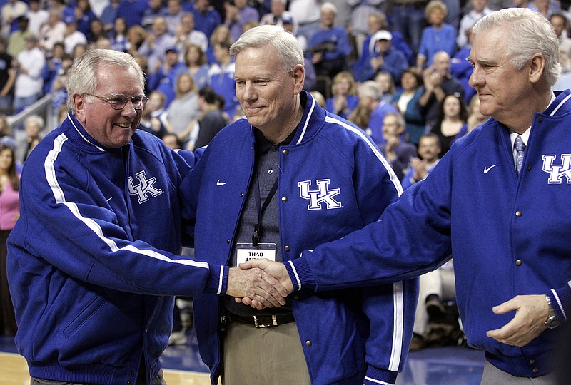 Members of  "Rupp's Runts" basketball team, from left to right, Larry Conley, Thad Jaracz and Tommy Kron are honored during half time of Kentucky's 80-78 victory over South Carolina at Rupp Arena in Lexington, Ky., Saturday, Jan. 21, 2006. (AP Photo/James Crisp) 