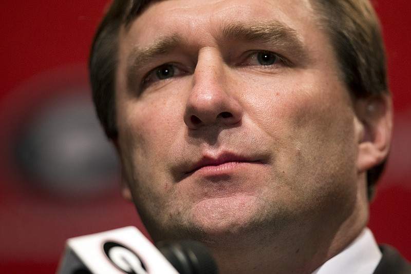 Alabama defensive coordinator Kirby Smart listens to a question from a reporter during a press conference where he was introduced as Georgia's new head football coach  Monday, Dec. 7, 2015, in Athens, Ga. Smart will stay with the Crimson Tide through the NCAA college playoffs. (AP Photo/John Bazemore) 