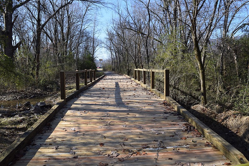 Crews are nearly finished with a segment along Coops Creek in Dunlap that completes the first three phases of the town's greenway project.