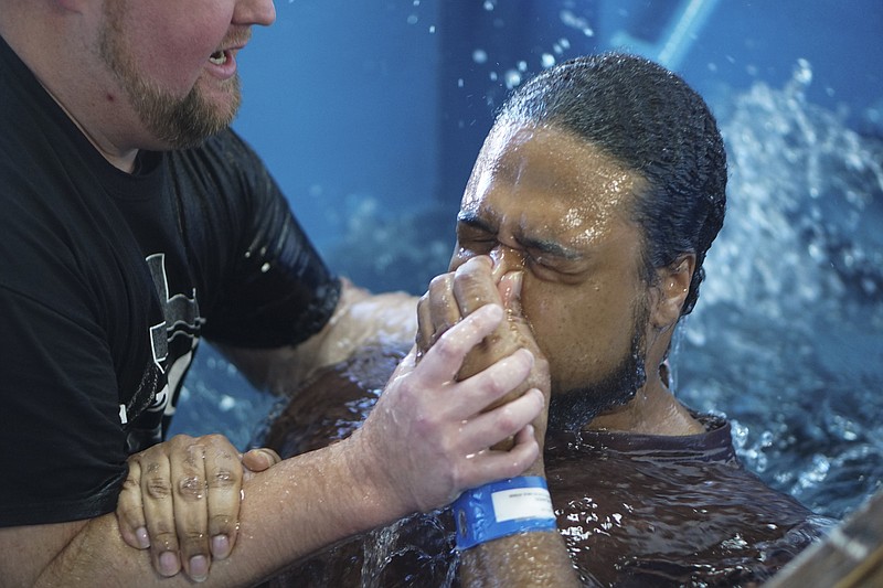 Dr. Ronnie Phillips Jr. baptizes inmate Curtis Carter while inside of the Hamilton County Jail on Monday, Dec. 14, 2015.
