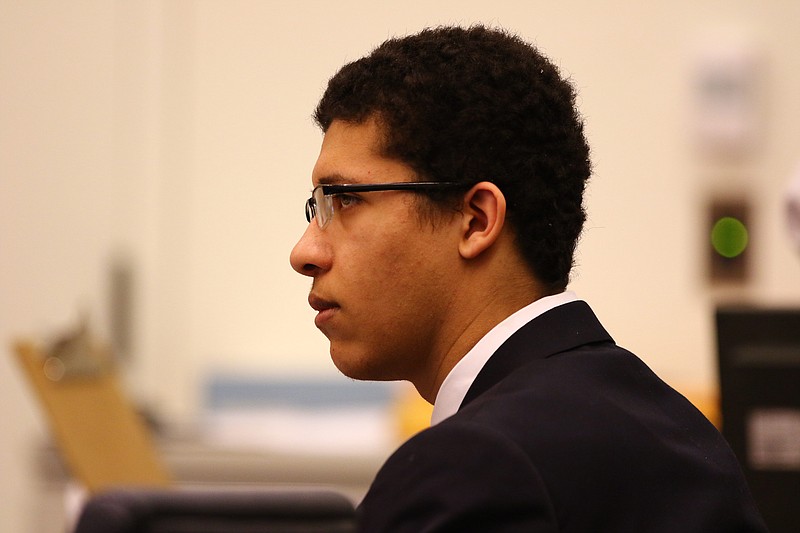 
              Philip Chism appears in Salem Superior Court, Monday, Dec. 14,2015, during closing arguments. The Massachusetts teenager who raped and killed his high school math teacher "knew right from wrong and could choose right from wrong," a prosecutor said Monday during closing arguments in the teen's murder trial. (Mark Lorenz/The Boston Herald via AP, Pool)
            