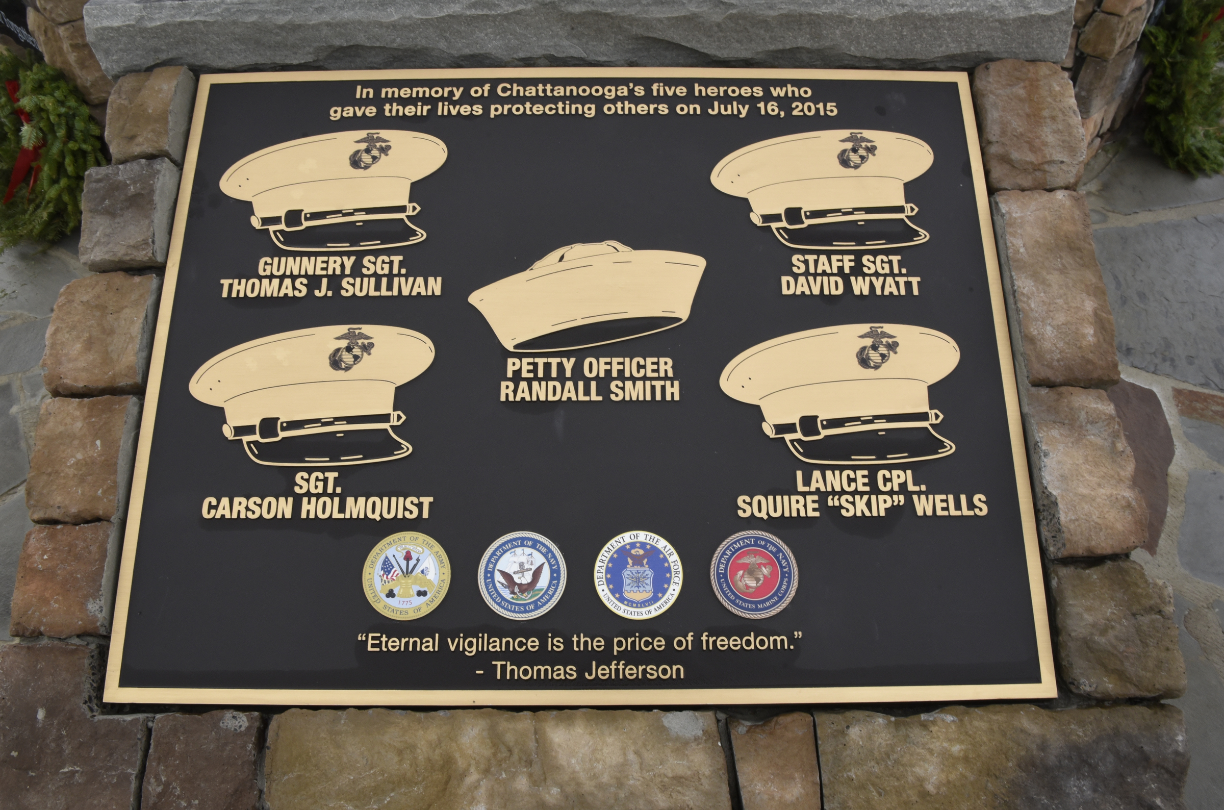 The memorial to the five service members killed in a terror incident on July 16, 2015, is photographed on Monday, Dec. 14, 2015, in Chattanooga, Tenn. The memorial is located in front of the Armed Forces Career Center on Lee Highway next to Highway 153, the scene of the first shots fired in the July attack.