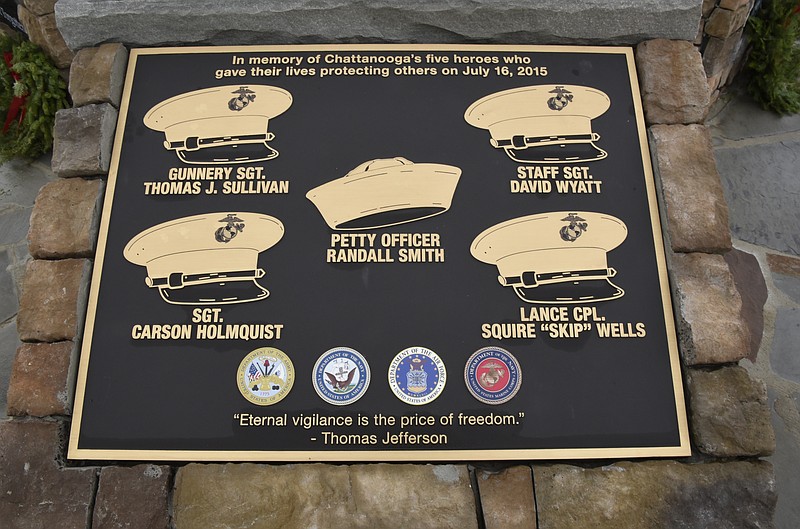 The memorial to the five service members killed in a terror incident on July 16, 2015, is photographed on Monday, Dec. 14, 2015, in Chattanooga, Tenn. The memorial is located in front of the Armed Forces Career Center on Lee Highway next to Highway 153, the scene of the first shots fired in the July attack. 