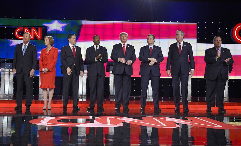 Republican presidential candidates, from left, John Kasich, Carly Fiorina, Marco Rubio, Ben Carson, Donald Trump, Ted Cruz, Jeb Bush, Chris Christie, and Rand Paul take the stage during the CNN Republican presidential debate at the Venetian Hotel & Casino on Tuesday, Dec. 15, 2015, in Las Vegas.