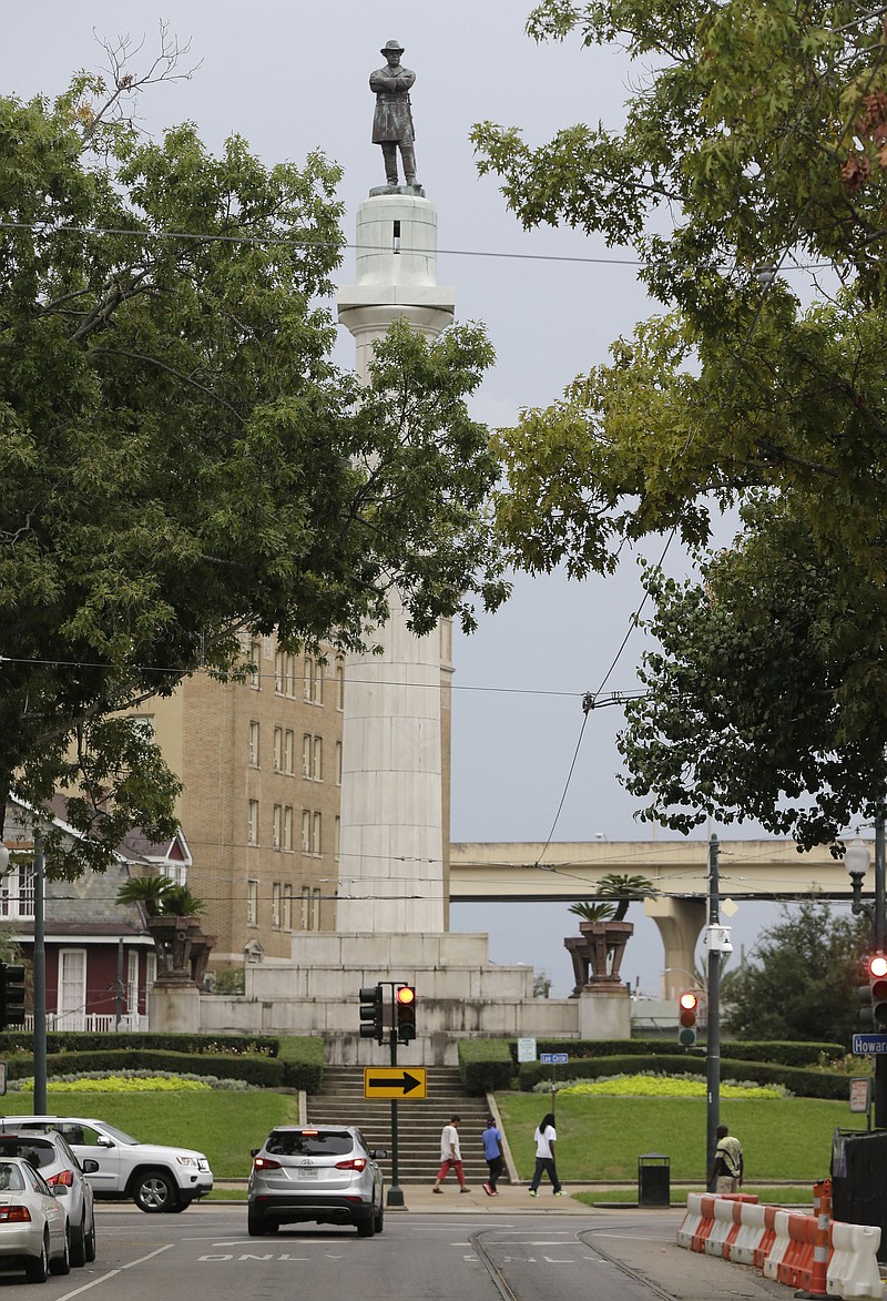 
              FILE -In this Sept. 2, 2015 photo, the Robert E. Lee Monument is seen in Lee Circle in New Orleans. On Thursday, Dec. 17, 2015, the City Council is set to vote on an ordinance to remove four monuments. A majority of council members and the mayor support the move, which would be one of the strongest gestures yet by American city to sever ties with Confederate history. (AP Photo/Gerald Herbert, File)
            