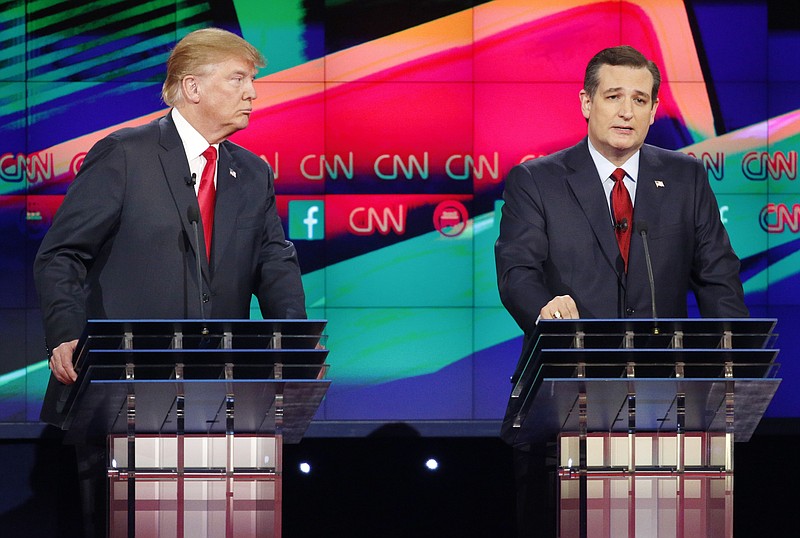 Texas Sen. Ted Cruz, right, makes a point at Tuesday's CNN Republican Presidential Debate in Las Vegas as Donald Trump looks.