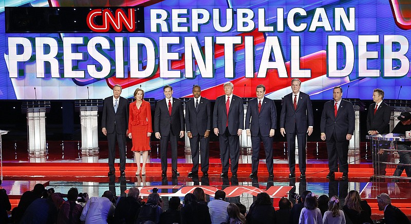 Republican presidential candidates, from left, John Kasich, Carly Fiorina, Marco Rubio, Ben Carson, Donald Trump, Ted Cruz, Jeb Bush, Chris Christie, and Rand Paul take the stage during the CNN Republican presidential debate at the Venetian Hotel & Casino on Tuesday, Dec. 15, 2015, in Las Vegas. (AP Photo/Mark J. Terrill)