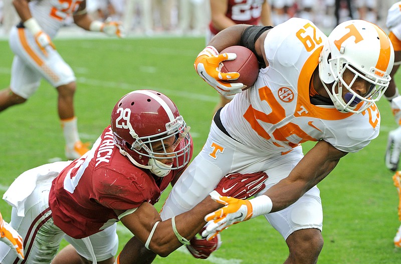 Tennessee Evan Berry (29) is tackled by Alabama defensive back Minkah Fitzpatrick (29) during an NCAA college football game  in Tuscaloosa, Ala. Saturday, Oct. 24, 2015. Alabama won 19-14. (Michael Patrick/Knoxville News Sentinel via AP)