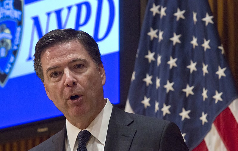 
              FBI Director James Comey speaks during a press conference after addressing the NYPD Shield Conference at NYPD headquarters, Wednesday, Dec. 16, 2015, in New York. Comey says the husband-and-wife team who killed 14 and wounded 21 others this month in San Bernardino, California, exchanged private direct messages and there has been no evidence to suggest the couple posted on social media. (AP Photo/Bebeto Matthews)
            