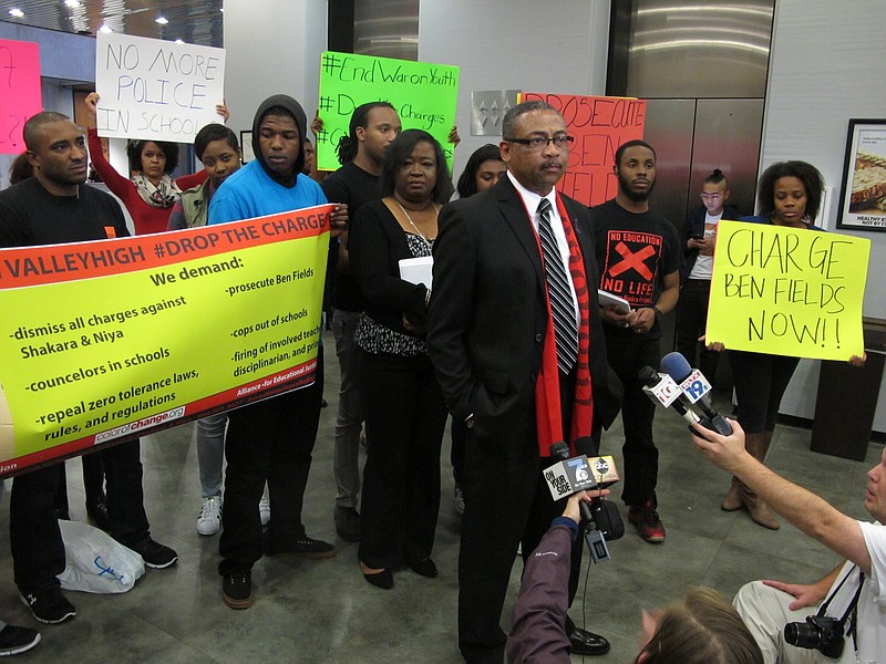 
              Pastor Thomas Dixon speaks at a rally at the Richland County courthouse, Thursday, Dec. 17, 2015, in Columbia, S.C., asking prosecutors to drop charges against a 16-year-old South Carolina high school student who was videotaped being yanked from her desk and thrown to the floor by a police officer in her classroom at Spring Valley High.  (AP Photo/Jeffrey Collins)
            