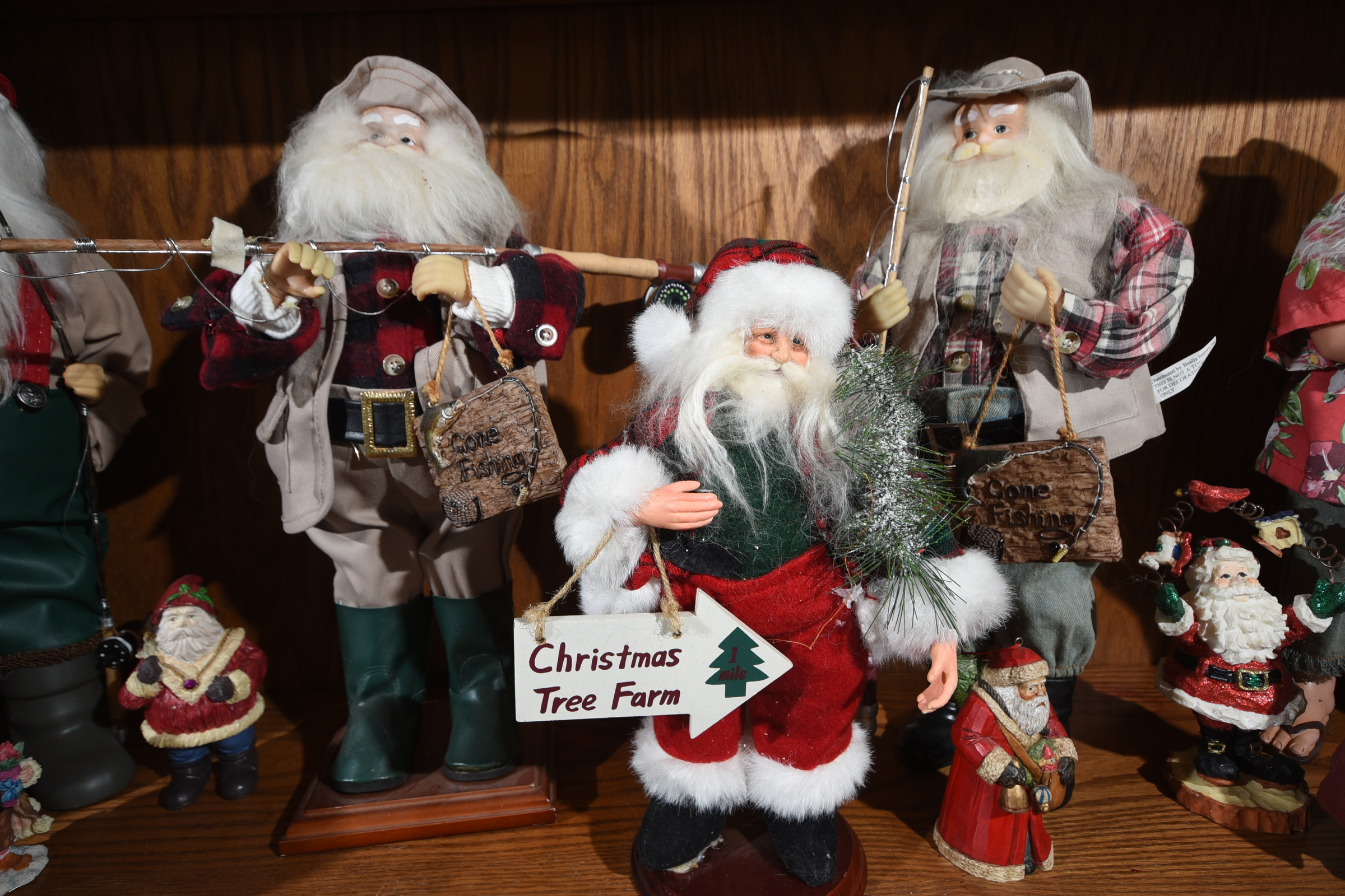 Katie Myers' collection of Santa figures includes these resin figurines, glass ornaments and woodland Santas. She can tell visitors the story behind every one.