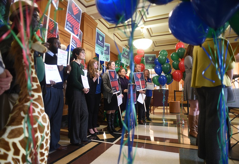 People gather during a news conference on Nov. 16 at the City Hall to announce #CHAgives Day.